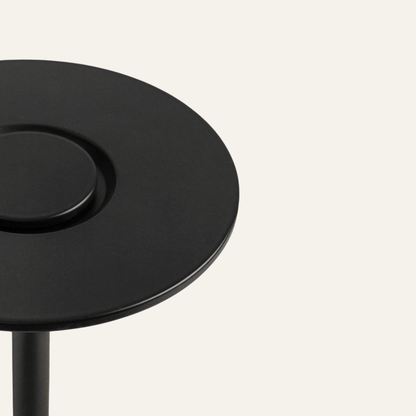 Black round table on a white background