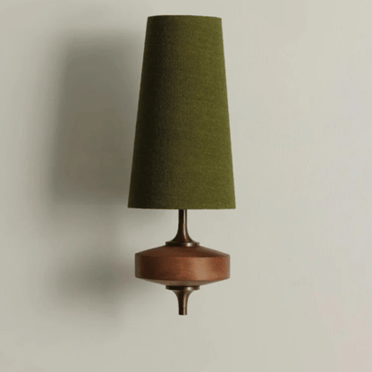 Wall-mounted lamp with a green cone-shaped shade and wooden base on a neutral background