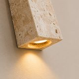 Concrete wall light fixture on a neutral background