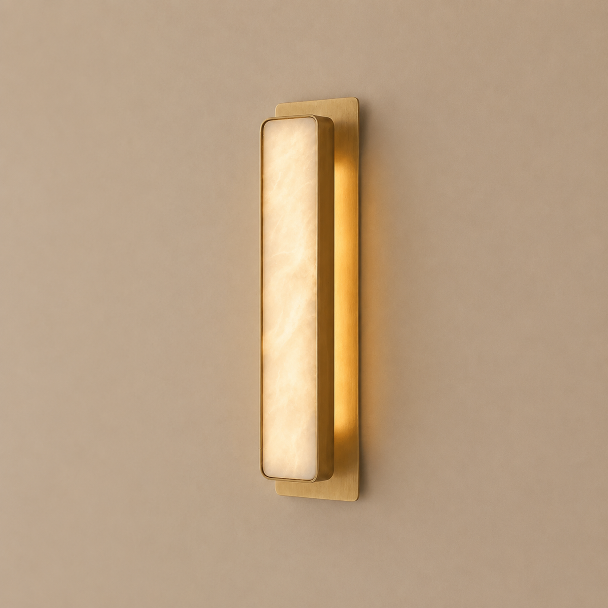 Gold wall sconce on a beige wall