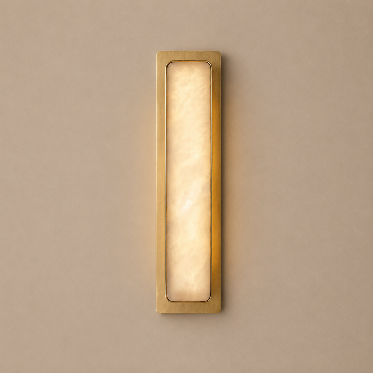 Rectangular wall light fixture with gold frame and glass cover on a beige wall.