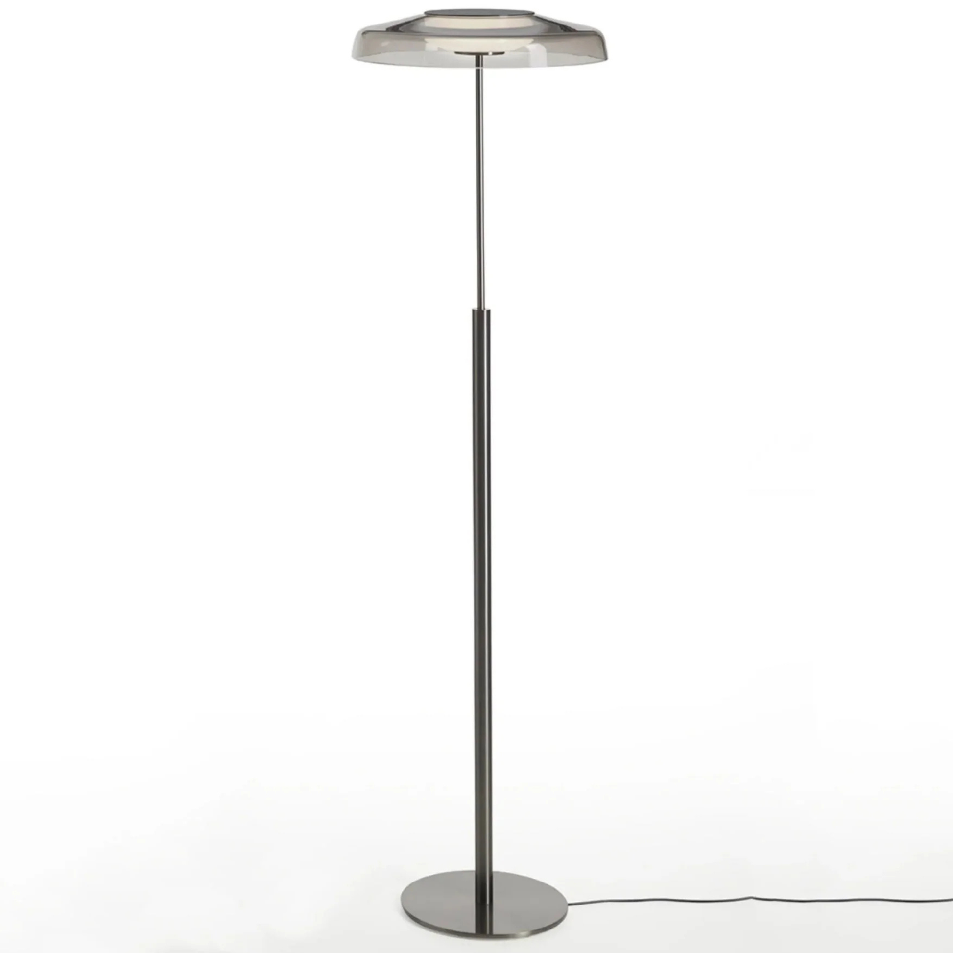 Minimalist white background photo of the same lamp design, showing its thin pole and circular base.