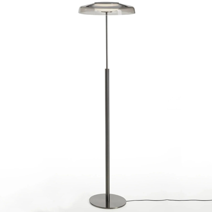Minimalist white background photo of the same lamp design, showing its thin pole and circular base.