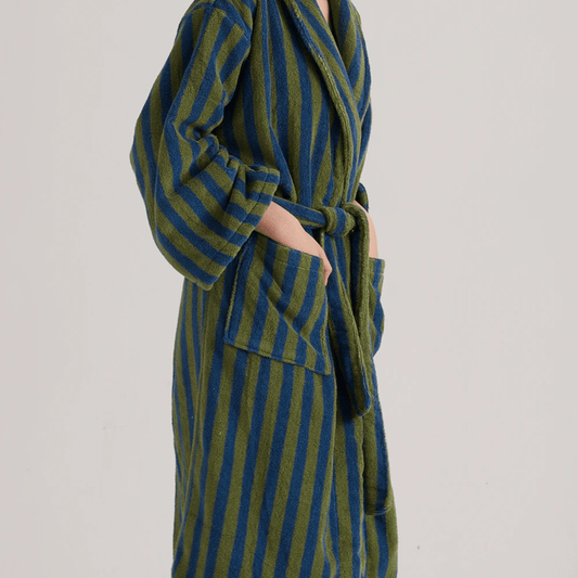 Green and blue striped robe on a plain background