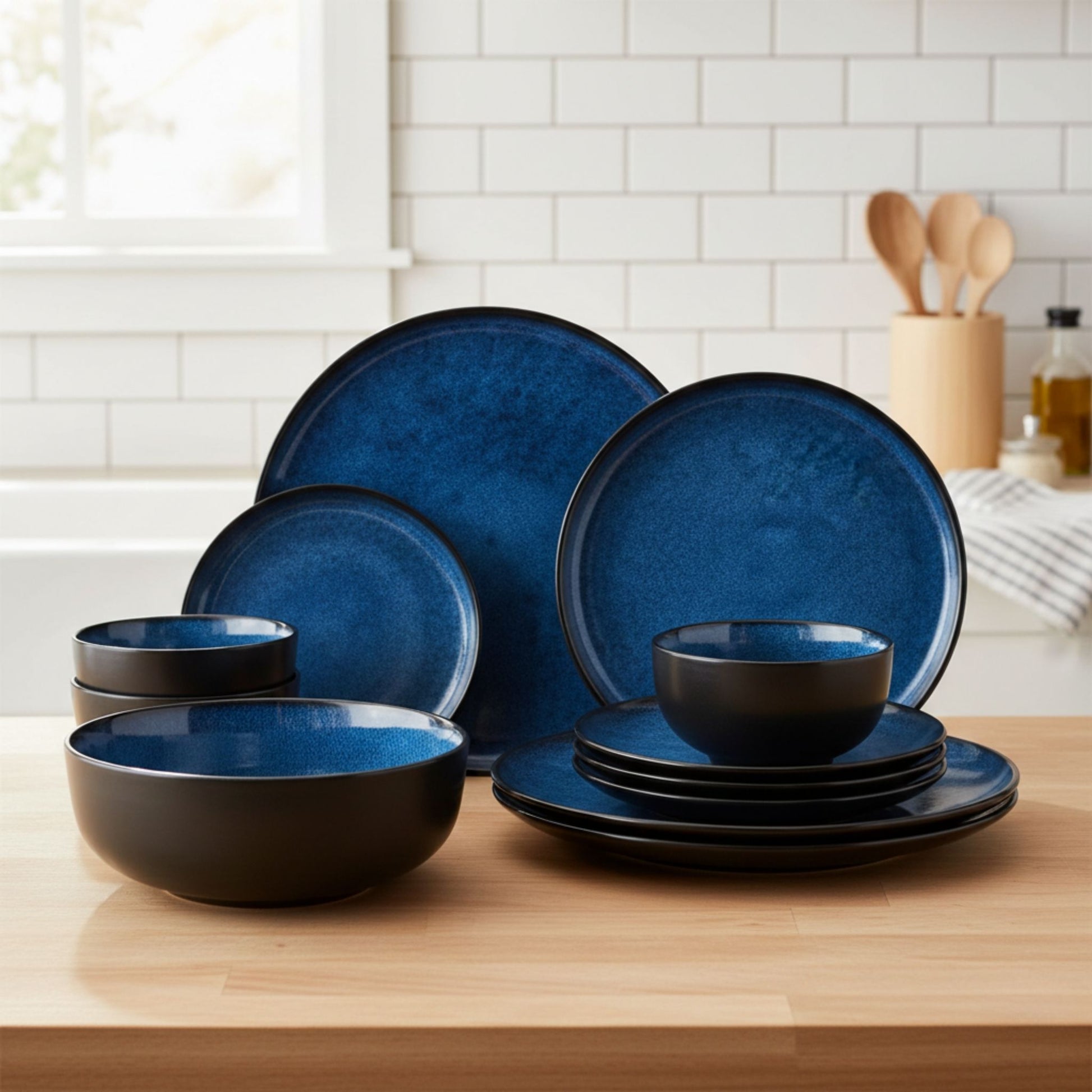 A collection of blue ceramic bowls filled with fresh salad placed beside matching plates.