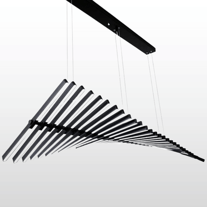 Black metal hanging sculpture on a white background