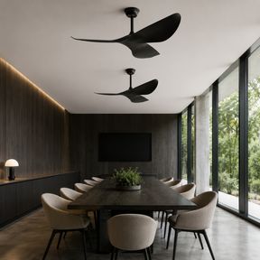 Modern dining room with black ceiling fans, a large table, and chairs.
