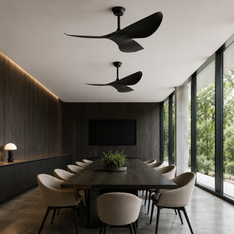 Modern dining room with black ceiling fans, a large table, and chairs.