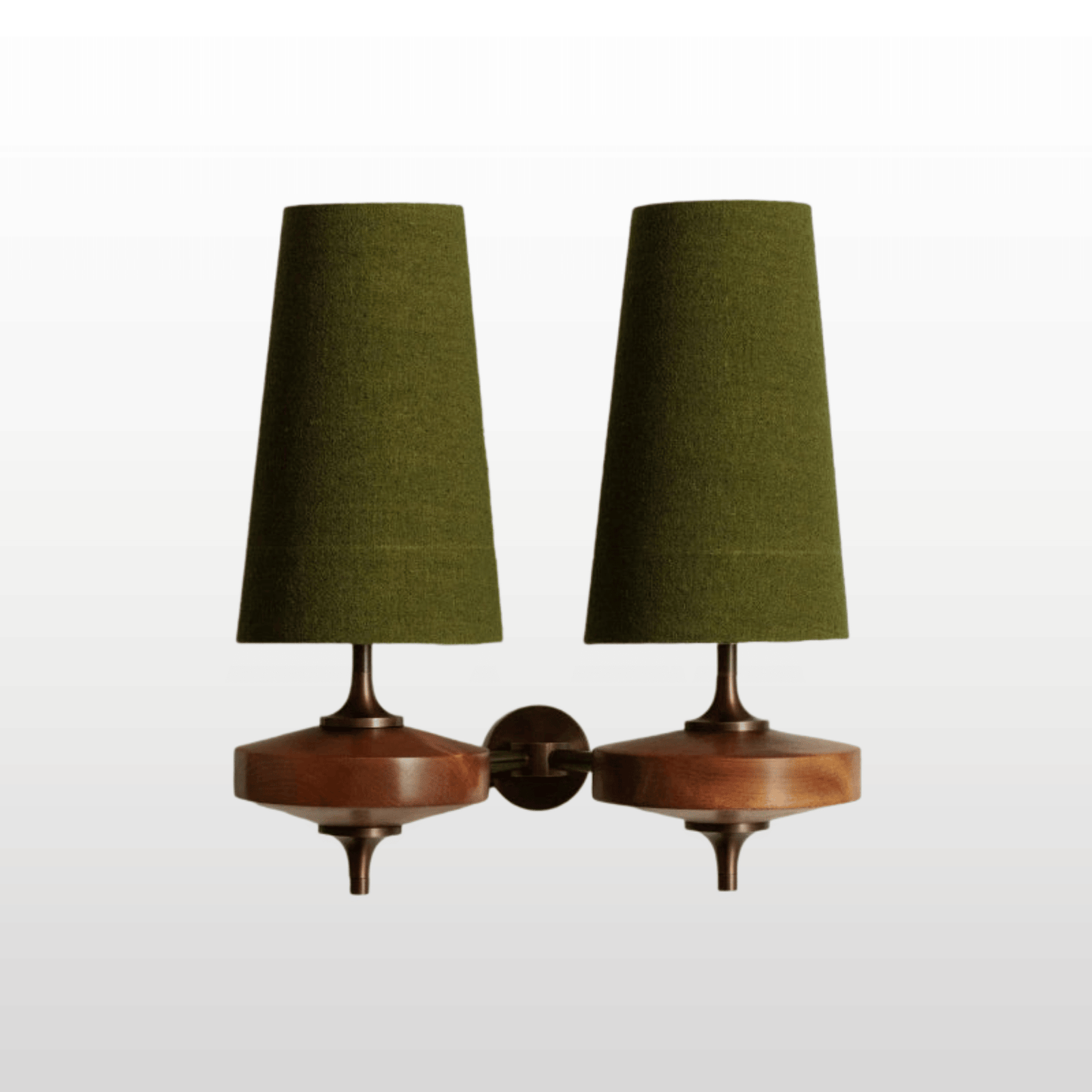 Pair of wall sconces with green lampshades on a white background