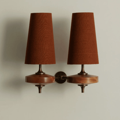 Pair of wall-mounted lamps with brown shades on a neutral background