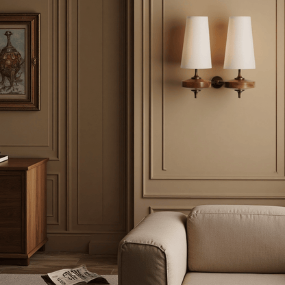 Living room with beige sofa, wooden cabinet, and wall sconces.