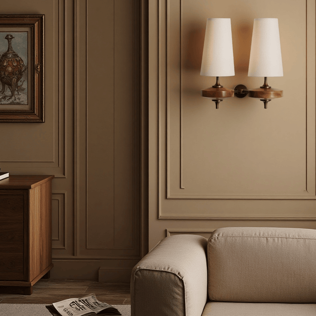 Living room with beige sofa, wooden cabinet, and wall sconces.