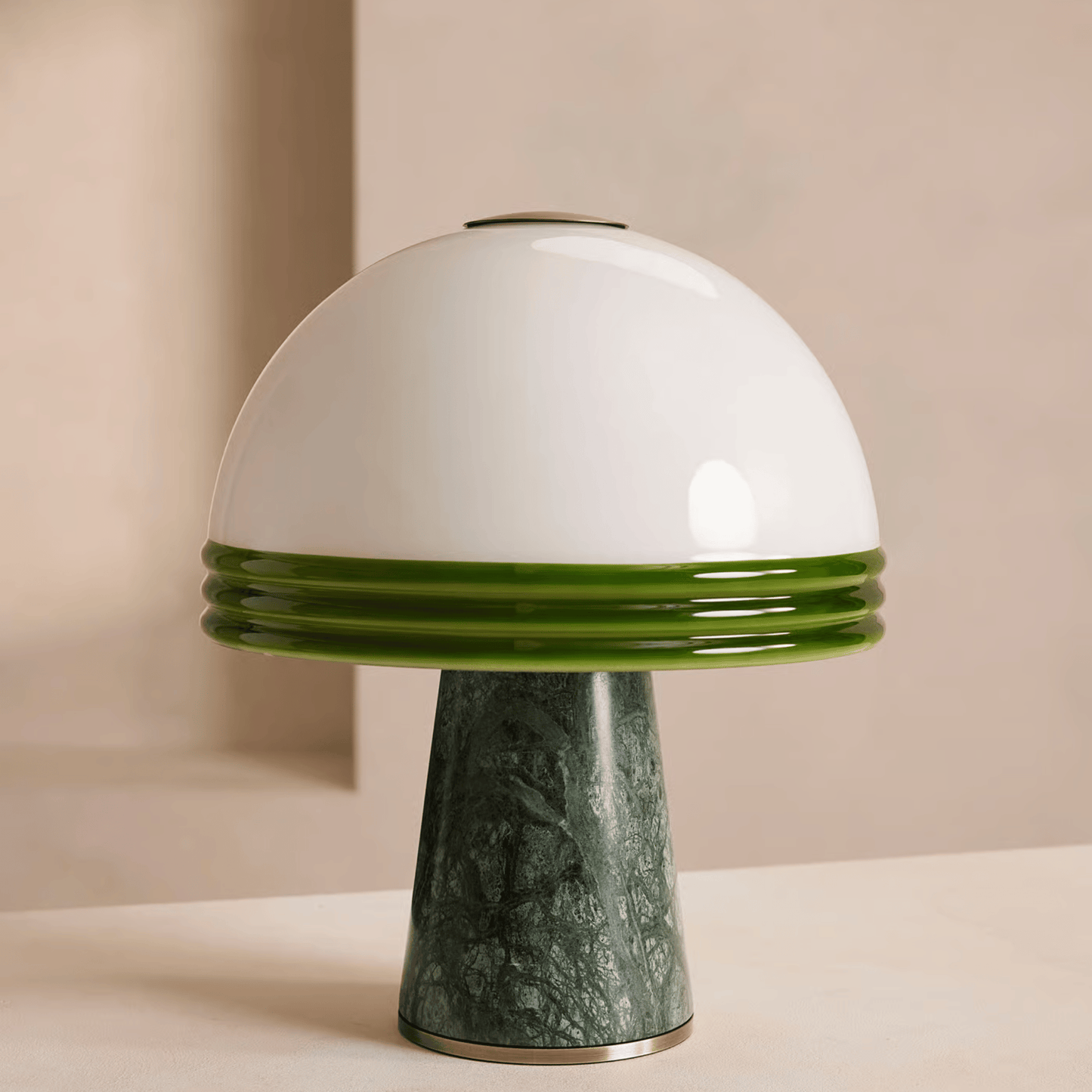 Mushroom-shaped lamp with white top and green base on a beige background