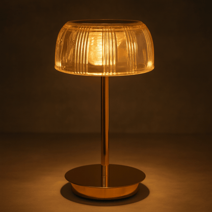 Decorative table lamp with a ribbed glass shade on a dark background
