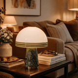 Decorative table lamp on a coffee table with a cozy living room background