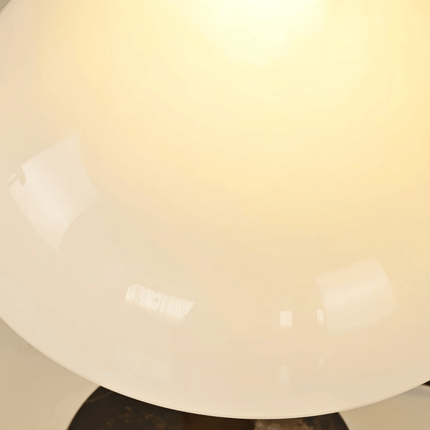 Close-up of a light fixture with a beige or off-white shade.