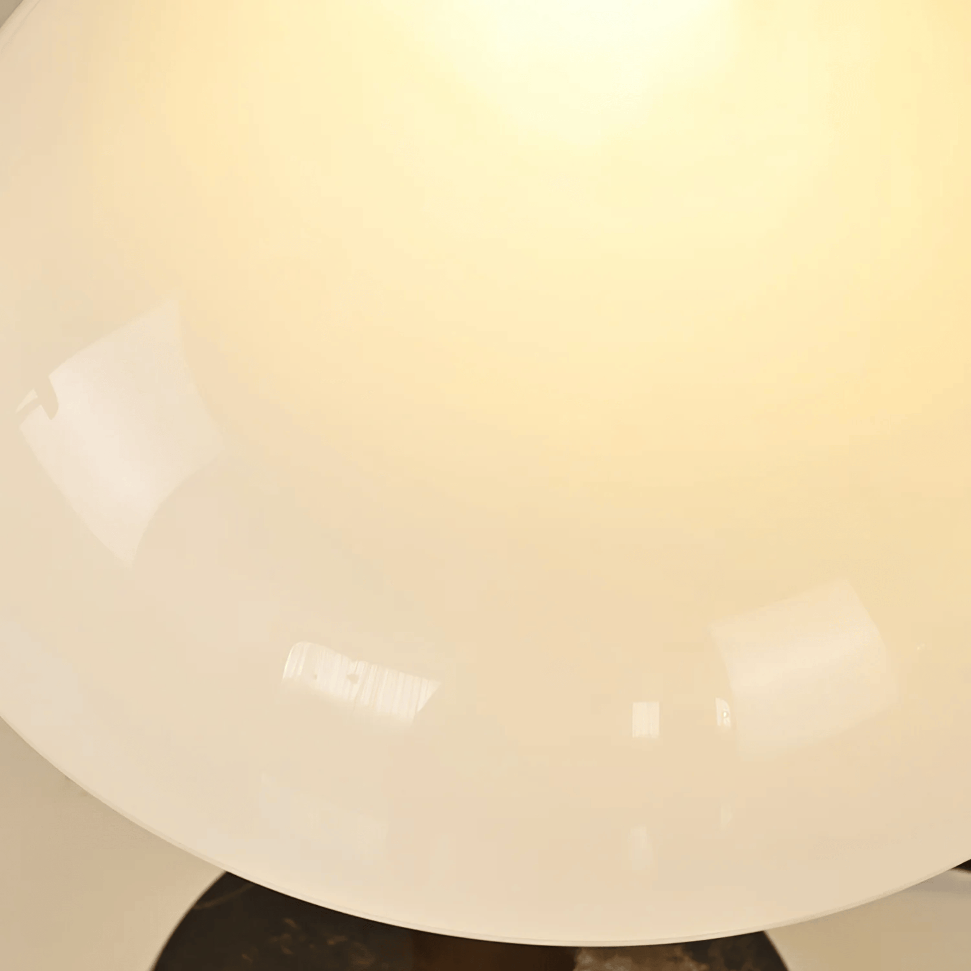 Close-up of a light fixture with a beige or off-white shade.