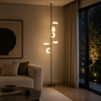 Modern living room with a floor lamp, sofa, and large window.