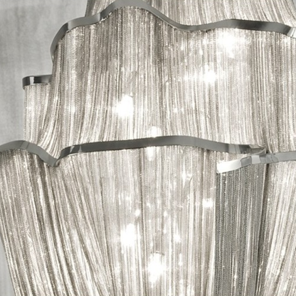 Close-up of a chandelier with crystal-like material and metallic accents.
