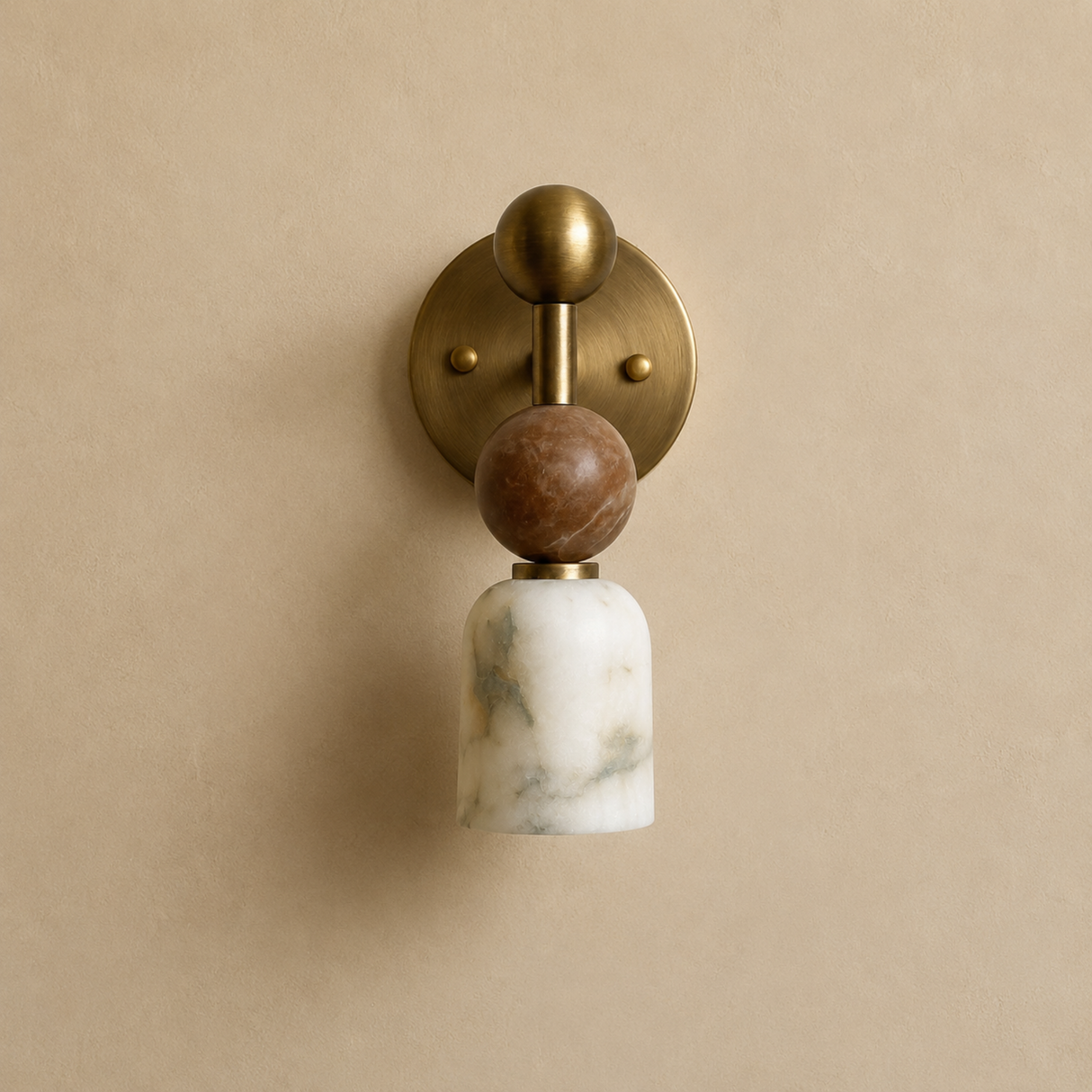 Wall sconce with marble and bronze design on a beige wall