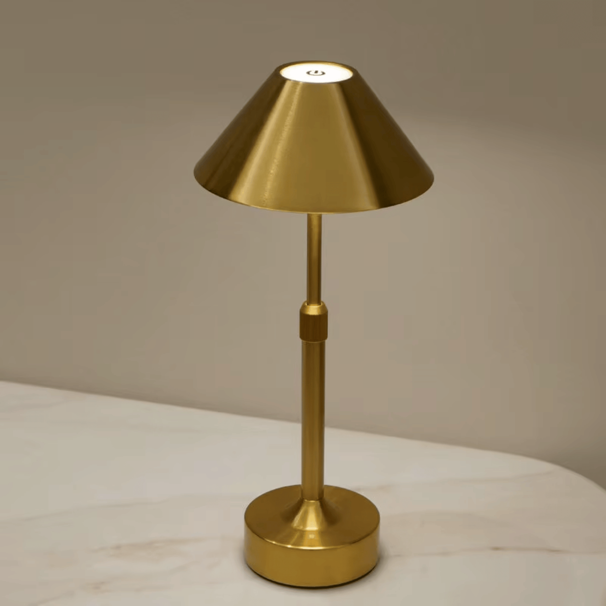 Gold table lamp on a neutral background