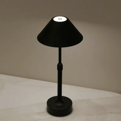 Black adjustable table lamp on a neutral background