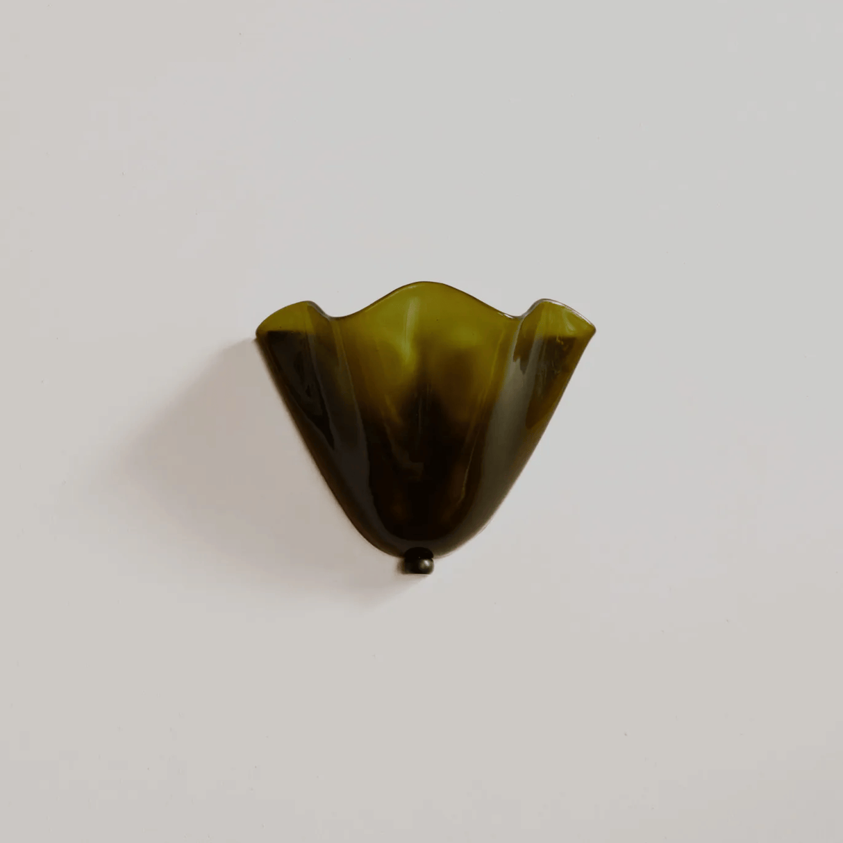 Green glass vase on a white background
