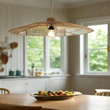 Woven pendant light with a visible bulb hanging