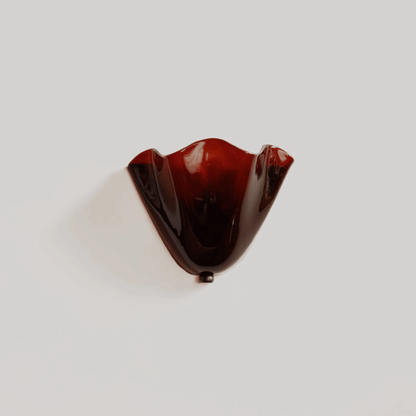 Brown glass object on a white background