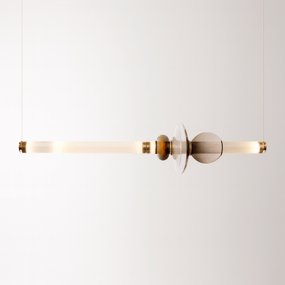Modern pendant light with gold and glass design on a white background