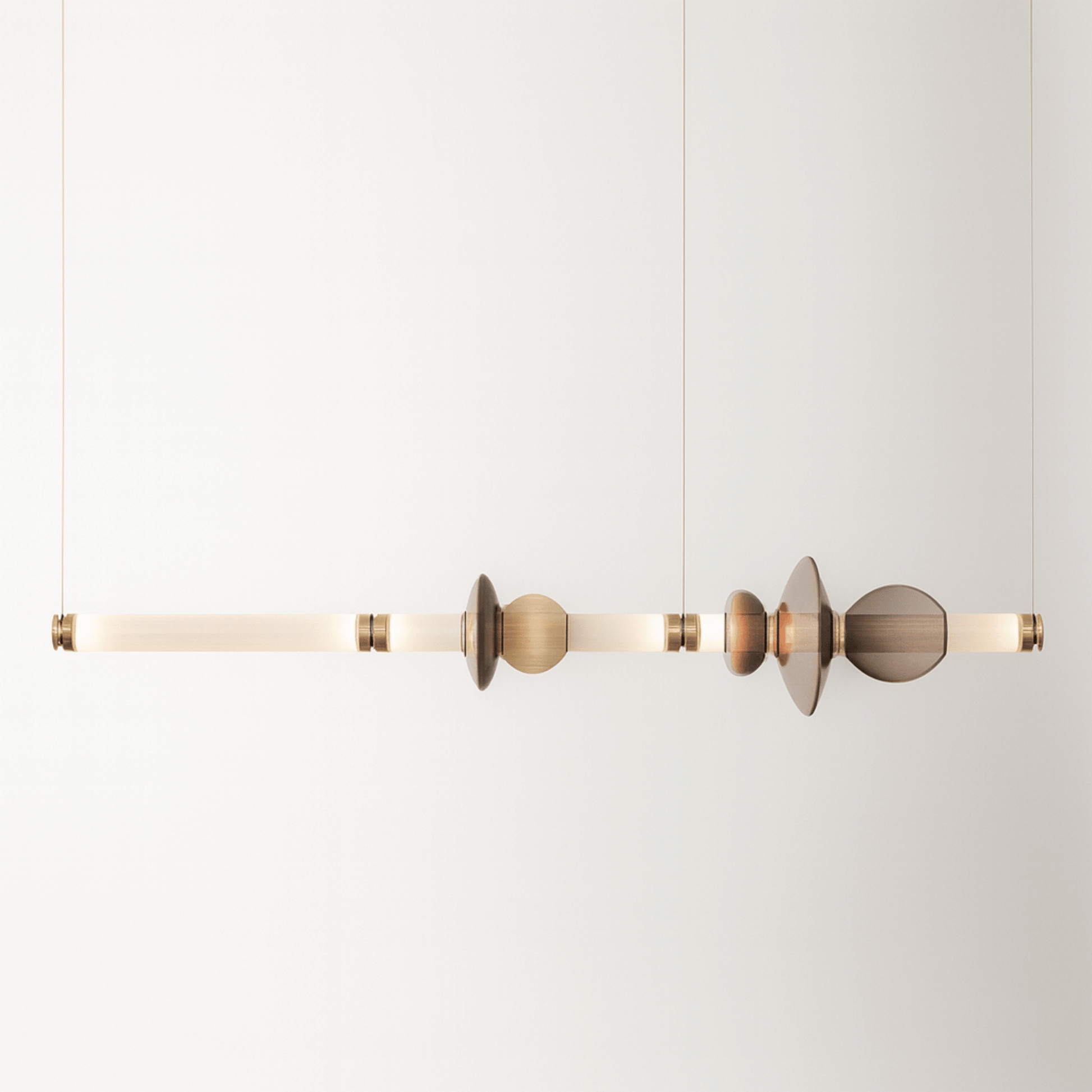 Modern pendant light with geometric design on a white background