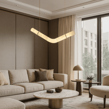 Modern living room with beige sofa, round coffee table, and pendant light.