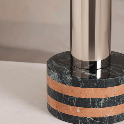 Marble base with metallic column on a neutral background