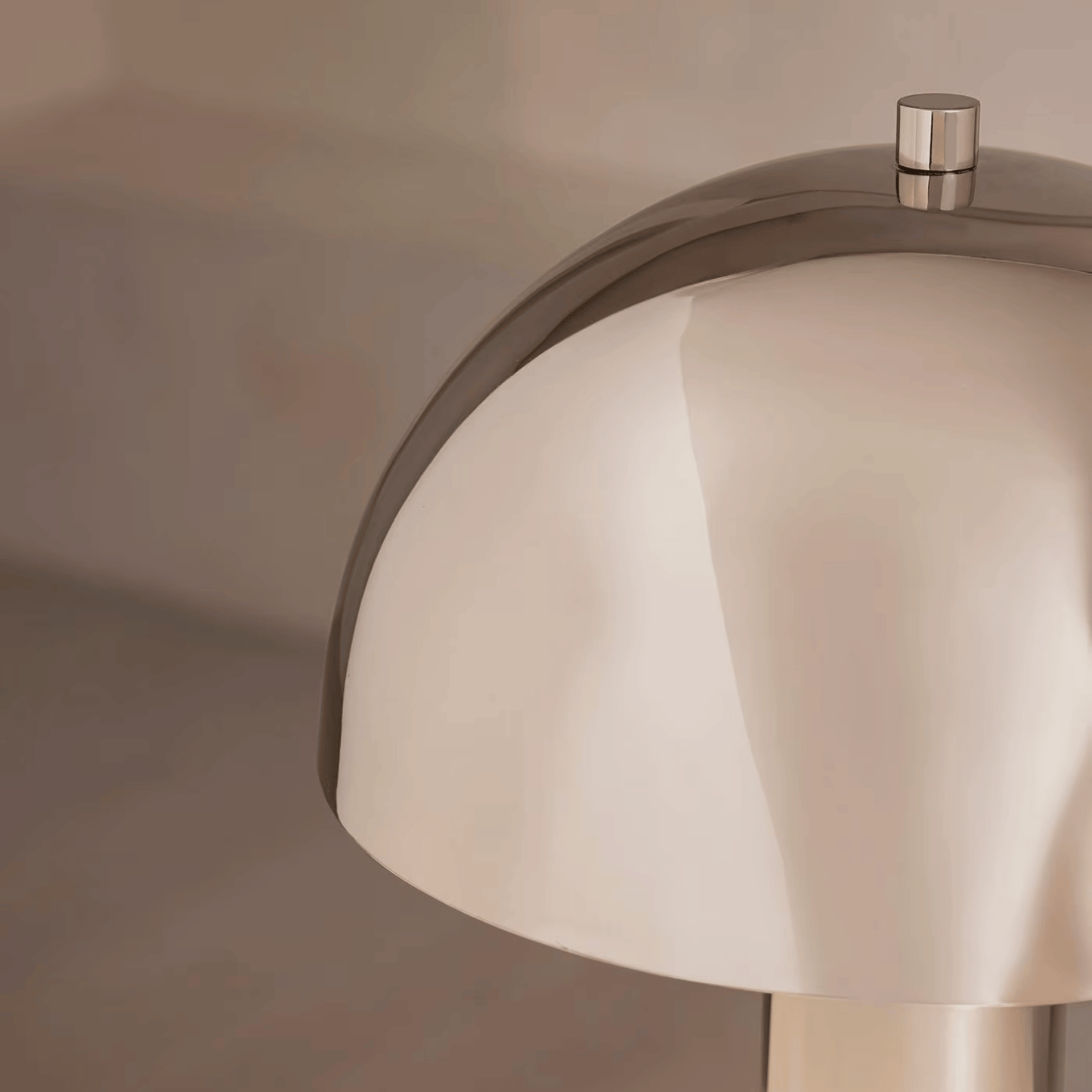 Close-up of a modern faucet with a neutral background