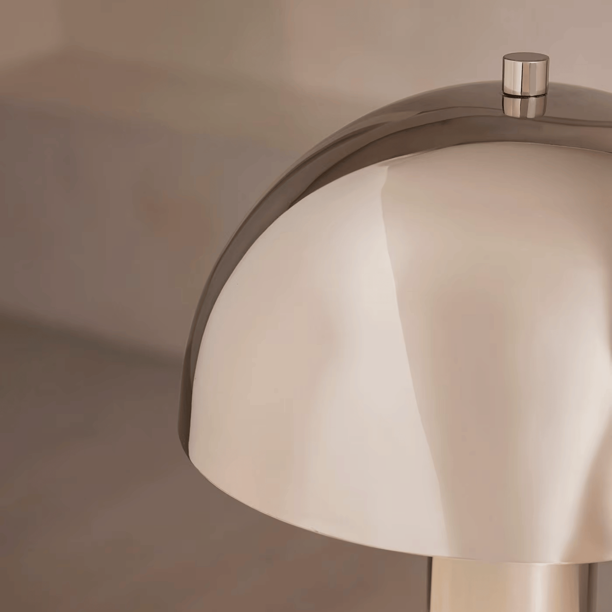 Close-up of a modern faucet with a neutral background