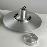 Metallic ceiling light fixture on a white background
