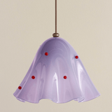 Purple pendant light with red accents on a beige background