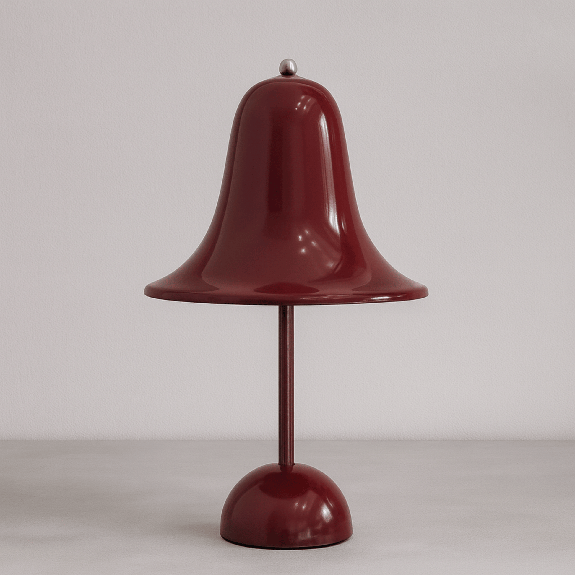 Red bell-shaped lamp on a plain background