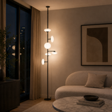 Modern living room with a floor lamp and a sofa.