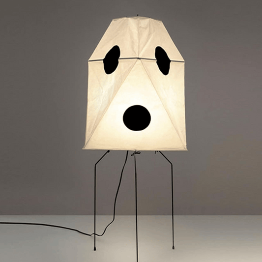 Lamp with panda face design on a gray background