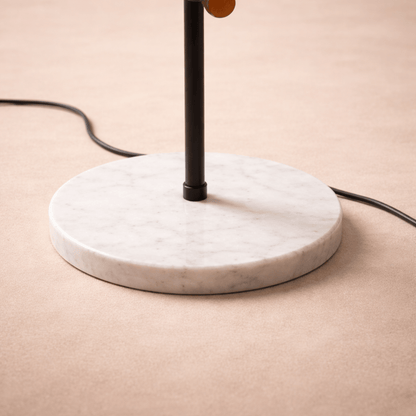 Table lamp with marble base on a beige surface