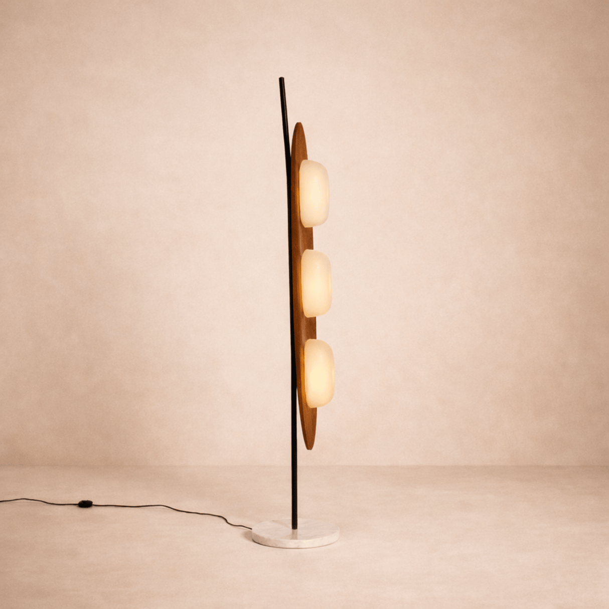 Modern floor lamp with multiple spherical lights on a beige background
