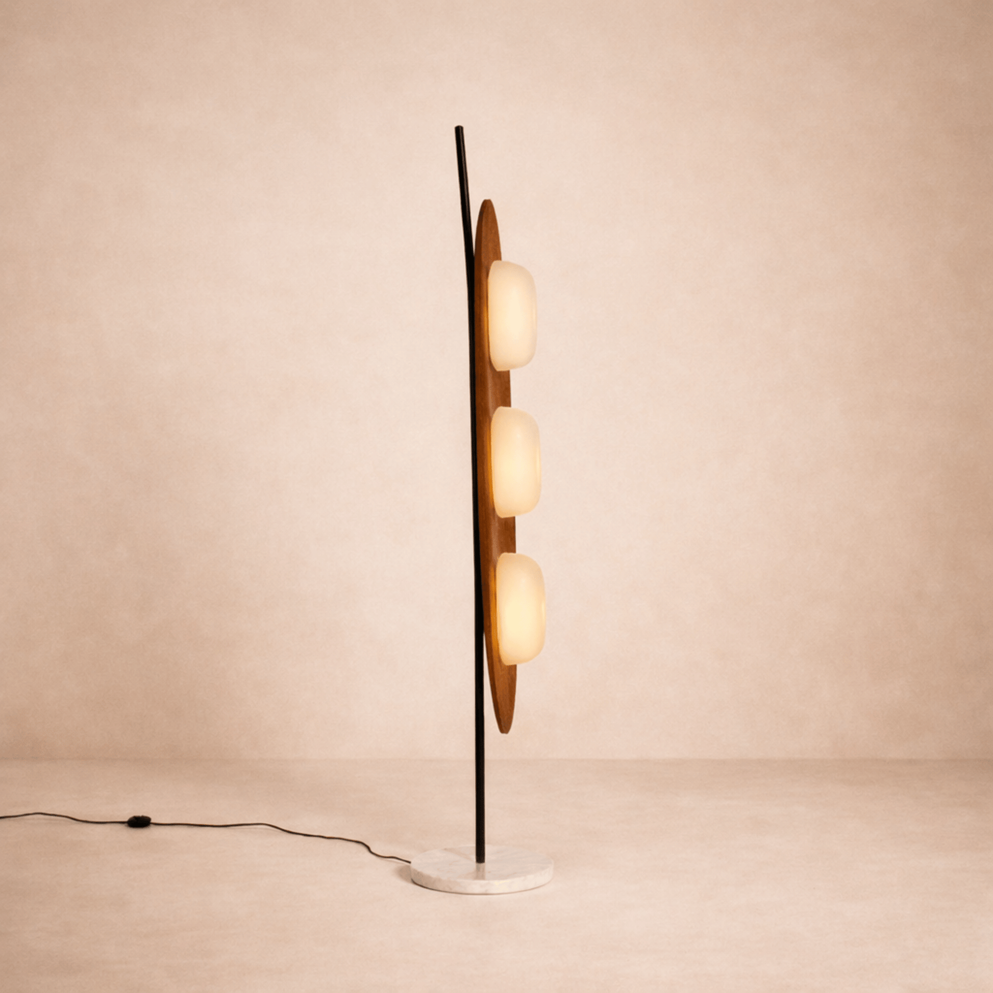 Modern floor lamp with multiple spherical lights on a beige background