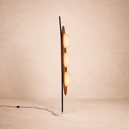 Modern floor lamp with multiple spherical lights on a beige background