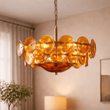Chandelier with amber-colored glass discs in a room setting