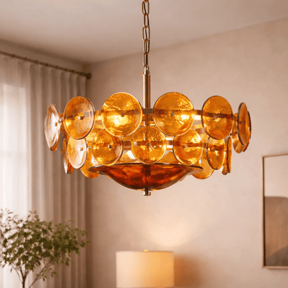 Chandelier with amber-colored glass discs in a room setting