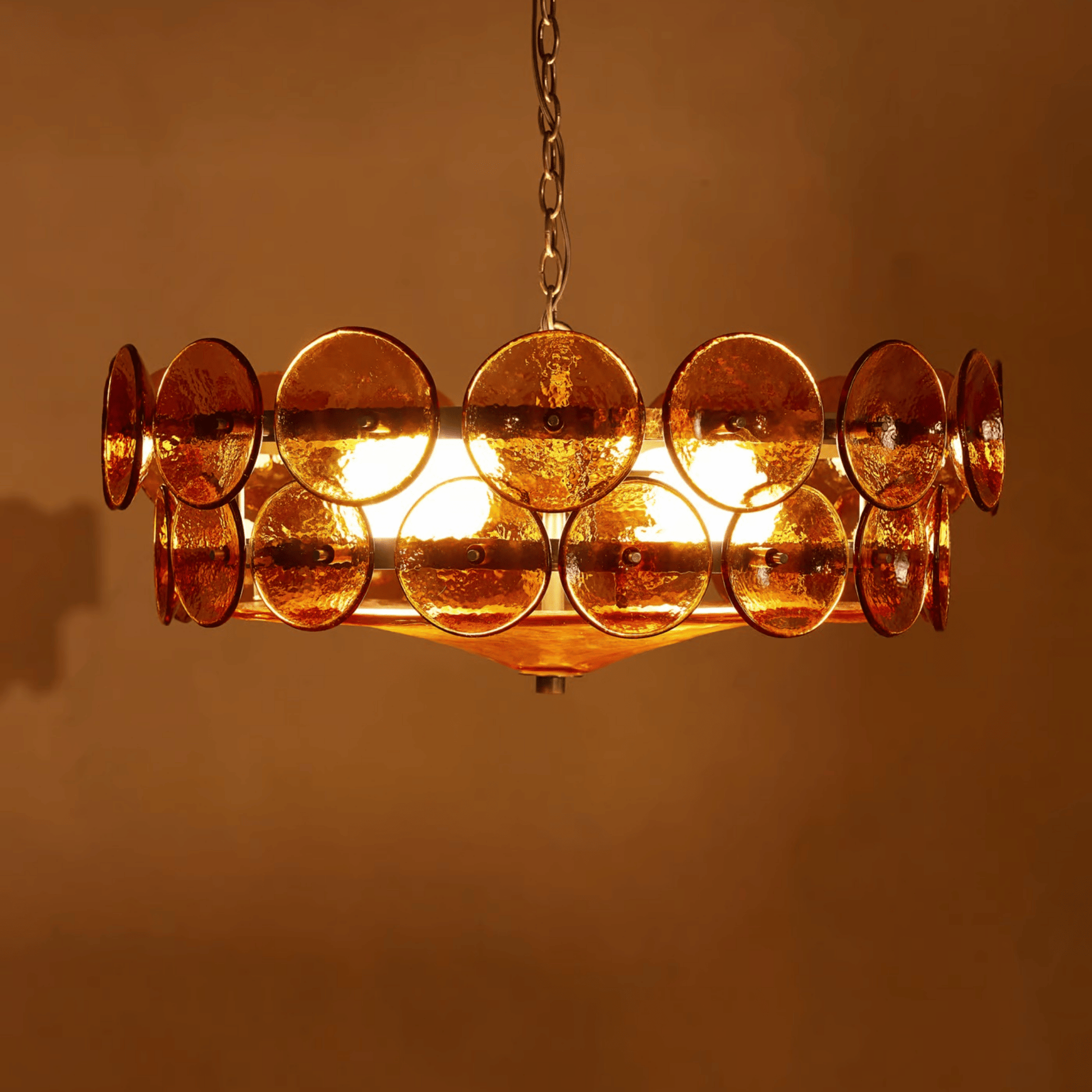 Chandelier with circular design on a warm brown background