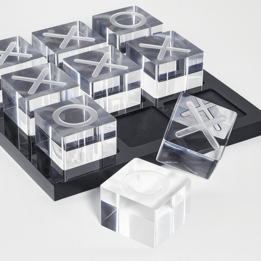 Clear acrylic blocks with letter 'X' and 'O' on a black tray