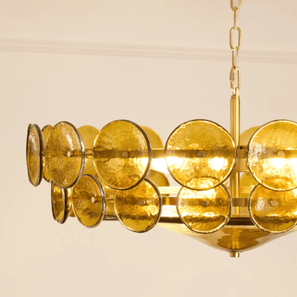 Gold chandelier with circular design on a beige background