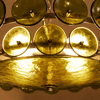 Close-up of a gold-colored chandelier with glass shades.